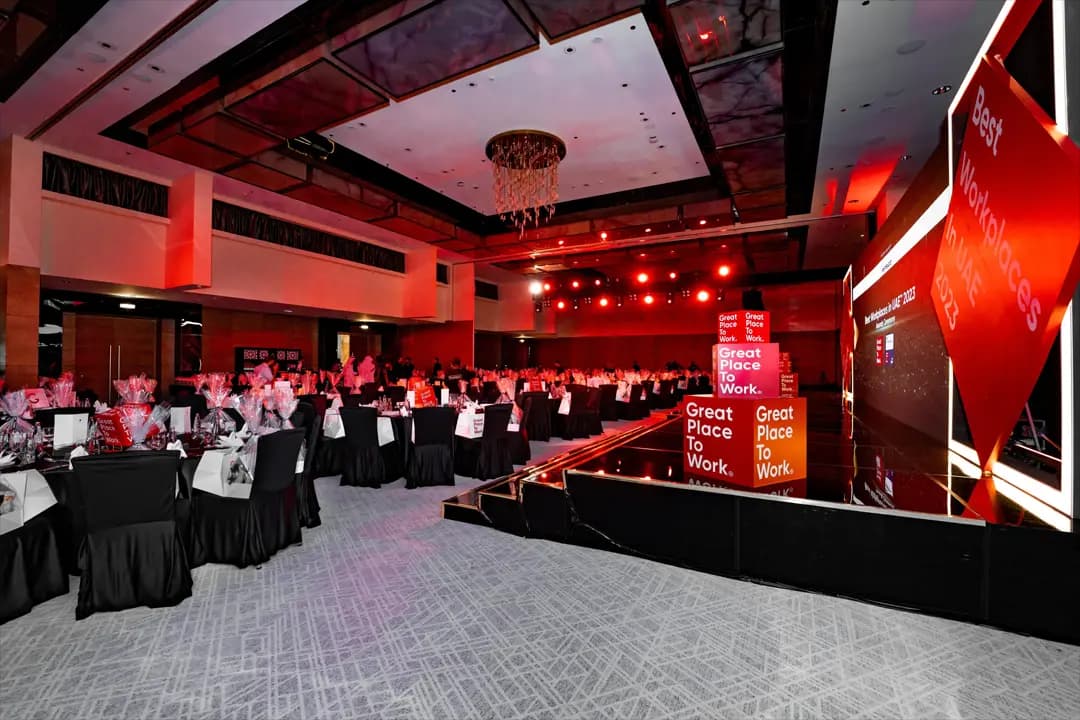 Cogent Solutions team receiving Best Workplace recognition
